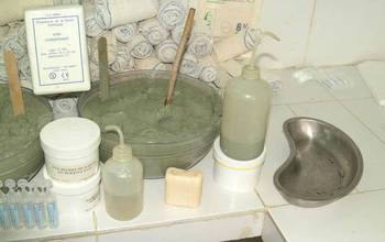 French green clays in pots, bottles and soap on a counter